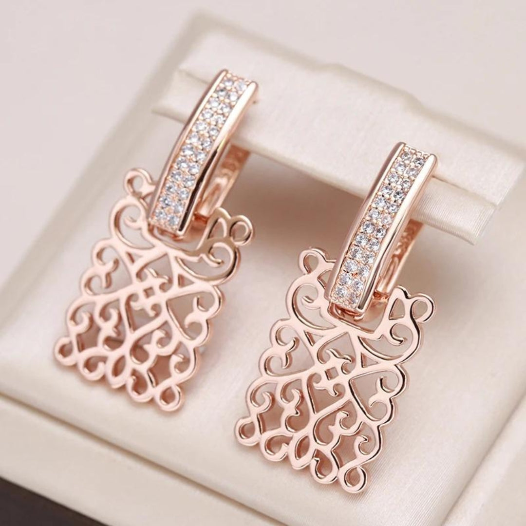 Boucles d'oreilles en or rose avec zircon