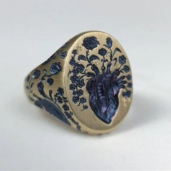 Bague vintage en or avec sceau floral bleu